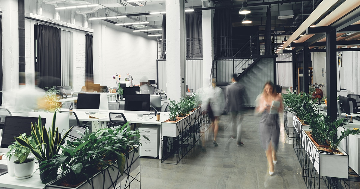 Office interior with blurred colleagues