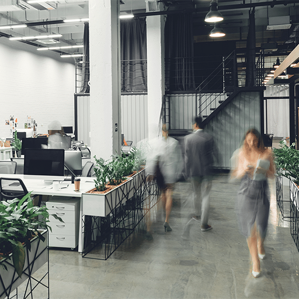 Office interior with blurred colleagues