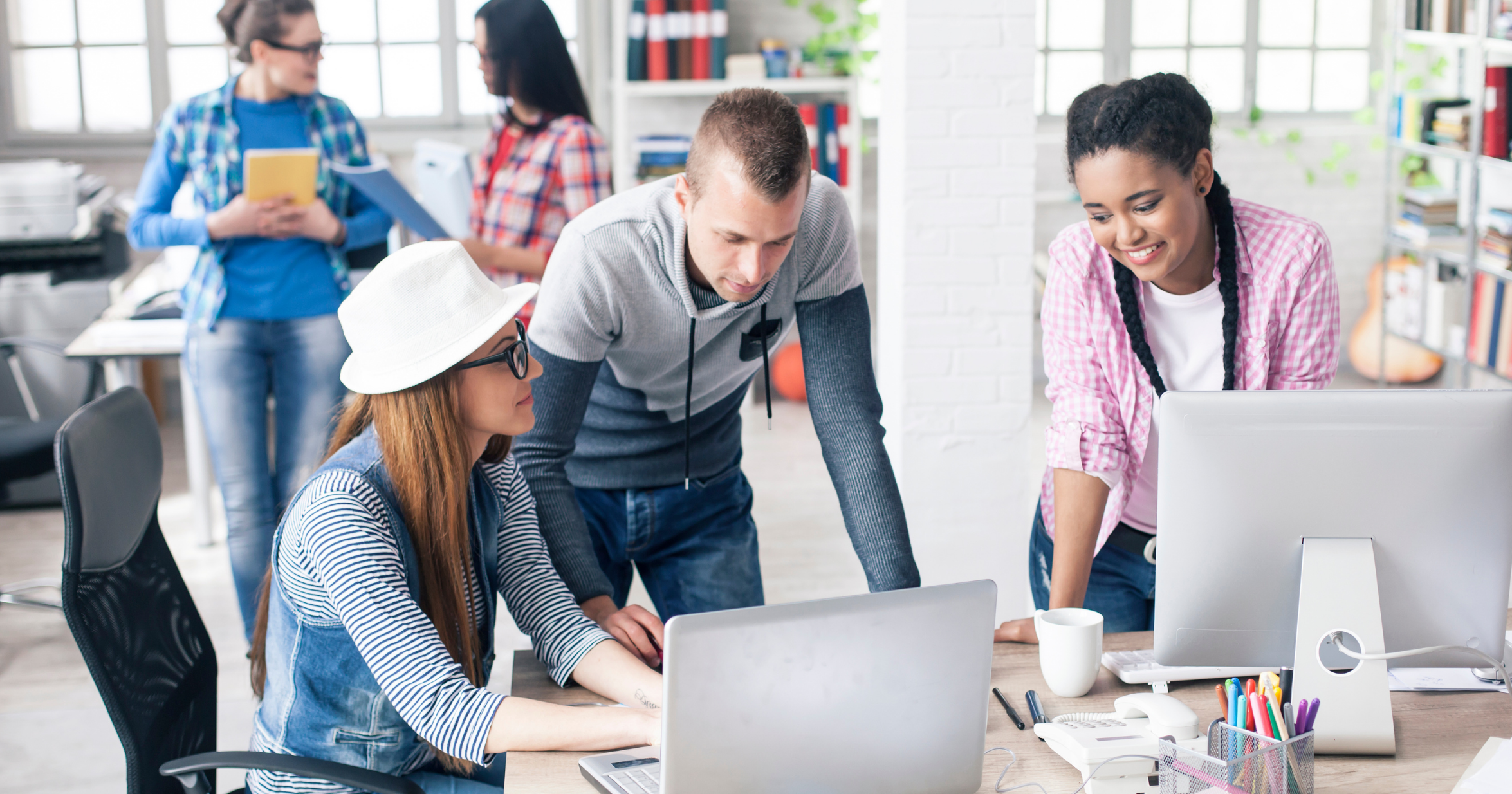 Young people at their sunny office.